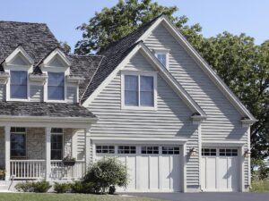 Gray siding on a two-story suburban home with covered porch