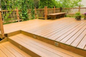 gorgeous wood decking surrounded by green foliage 