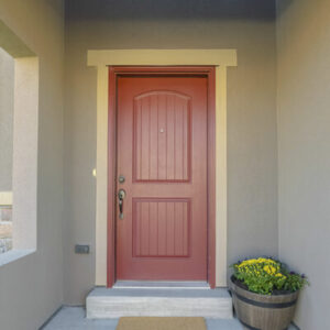 Door trim surrounding a red door